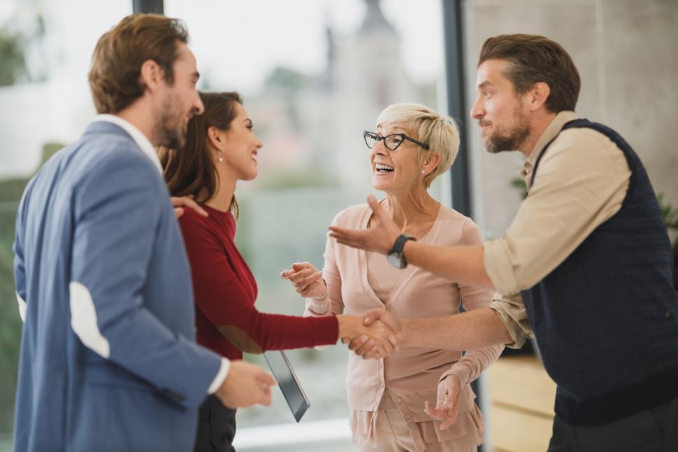group-of-people-greeting-each-other-in-a-lobby.jpg